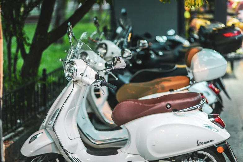 a row of motor scooters parked next to each other, a picture, by Gavin Nolan, trending on unsplash, white mechanical details, sitting on a motorcycle, 🚿🗝📝