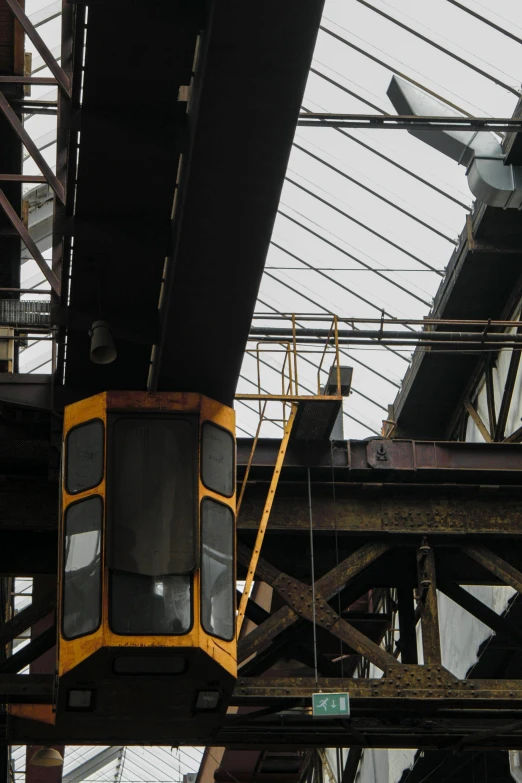 the underside of a train that is going over the tracks