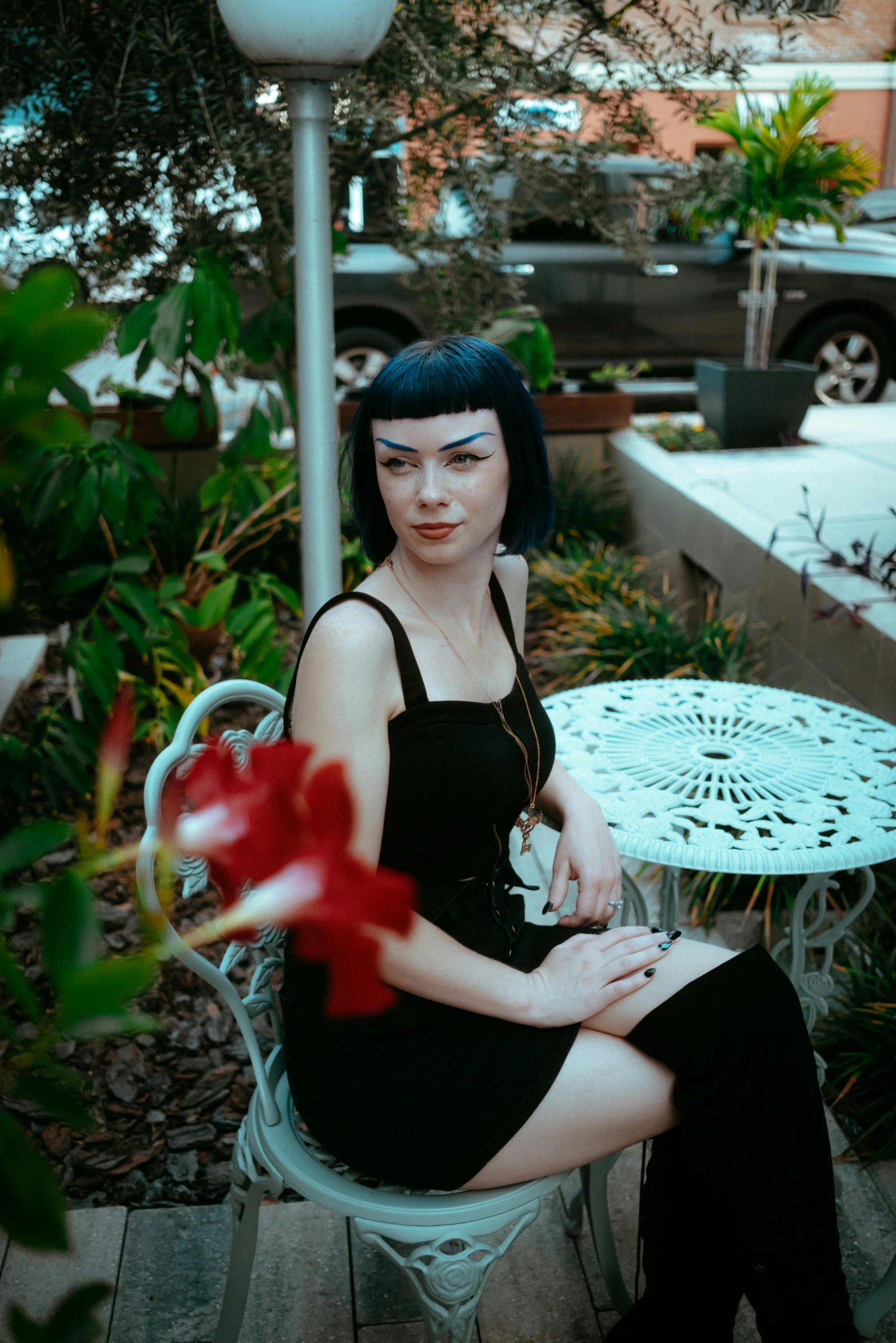 a person sitting on a chair with flowers