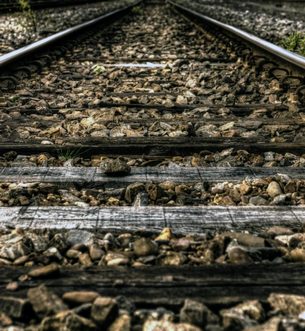 a close up of a train track on a cloudy day, pexels, realism, realistic »