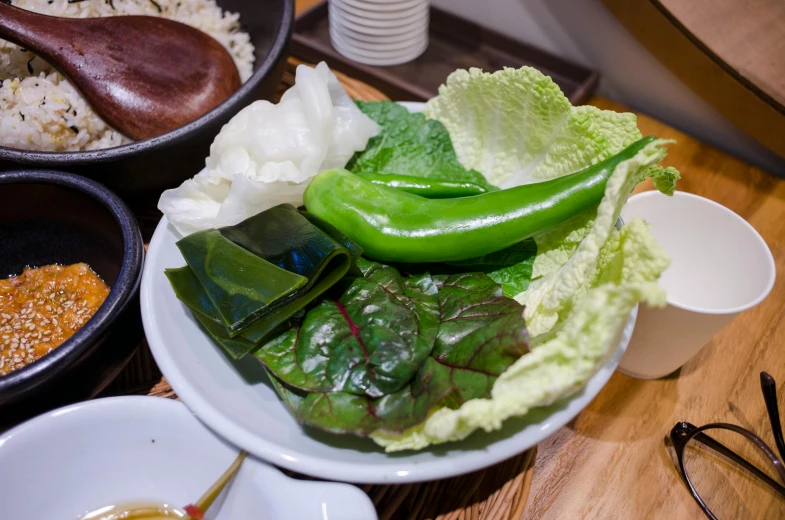 a close up of a plate of food on a table, shin hanga, greens), nostlagia, bowl filled with food, hot food