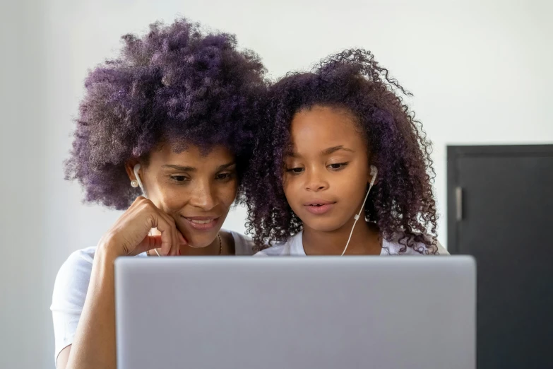 a couple of women sitting next to each other on a laptop, purple accents, kids, photo of a black woman, 15081959 21121991 01012000 4k