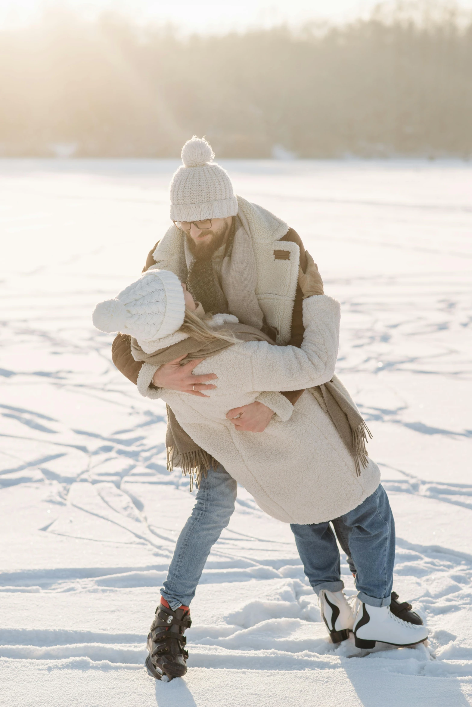 a man giving a woman a hug in the snow, walking on ice, hugging each other, best practice, tan
