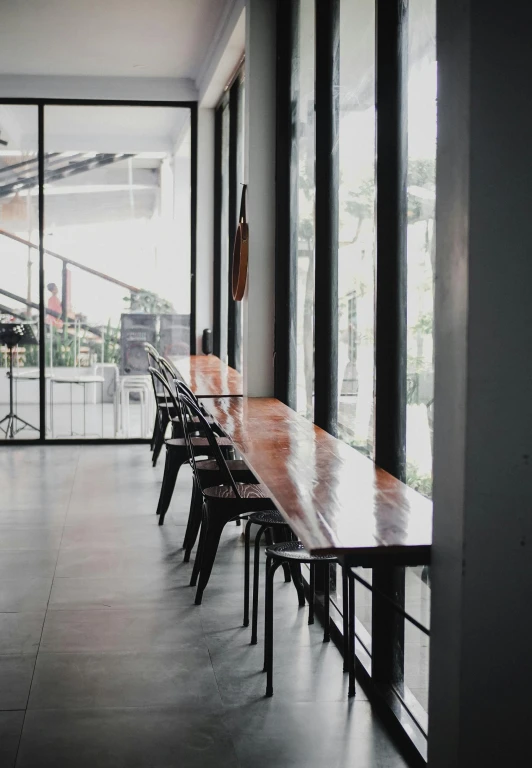 long table in a building near some open windows