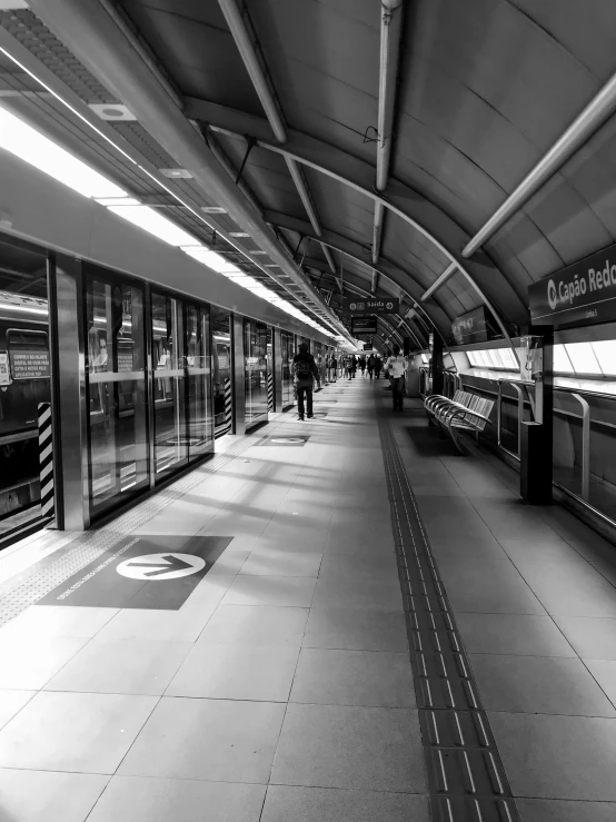 a black and white photo of a train station, by Joze Ciuha, cinematic. by leng jun, square lines, sao paulo, tourist photo