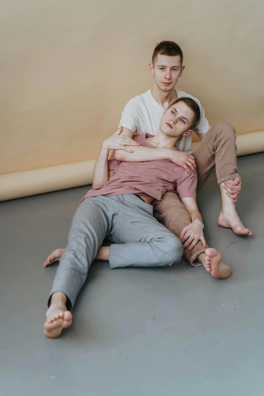 a man and a woman are sitting on the floor, by Matija Jama, nonbinary model, two men hugging, soft skin, alexey egorov