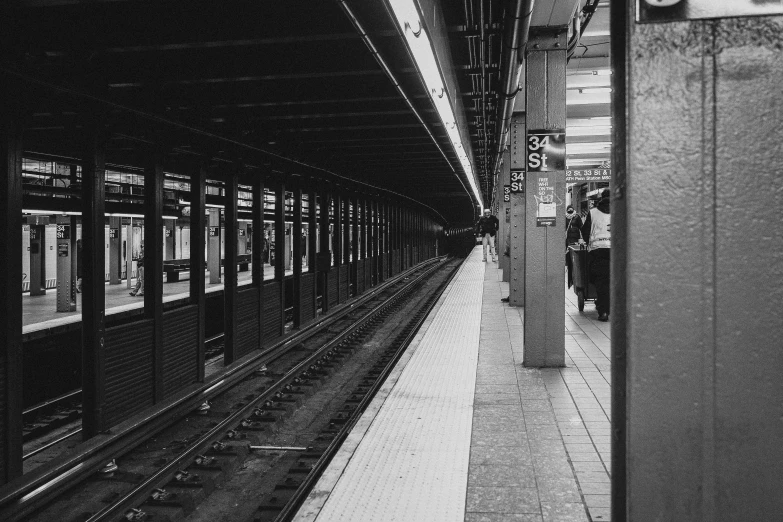 a black and white photo of a train station, unsplash, manhattan, 90s photo, square lines, color photo