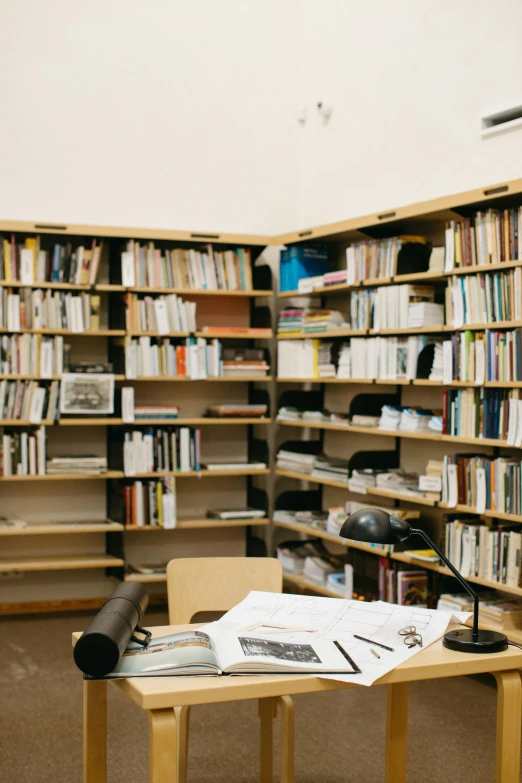 a table that has a bunch of books on it, arbeitsrat für kunst, research center, shelves filled with tomes, 2019 trending photo, archive material