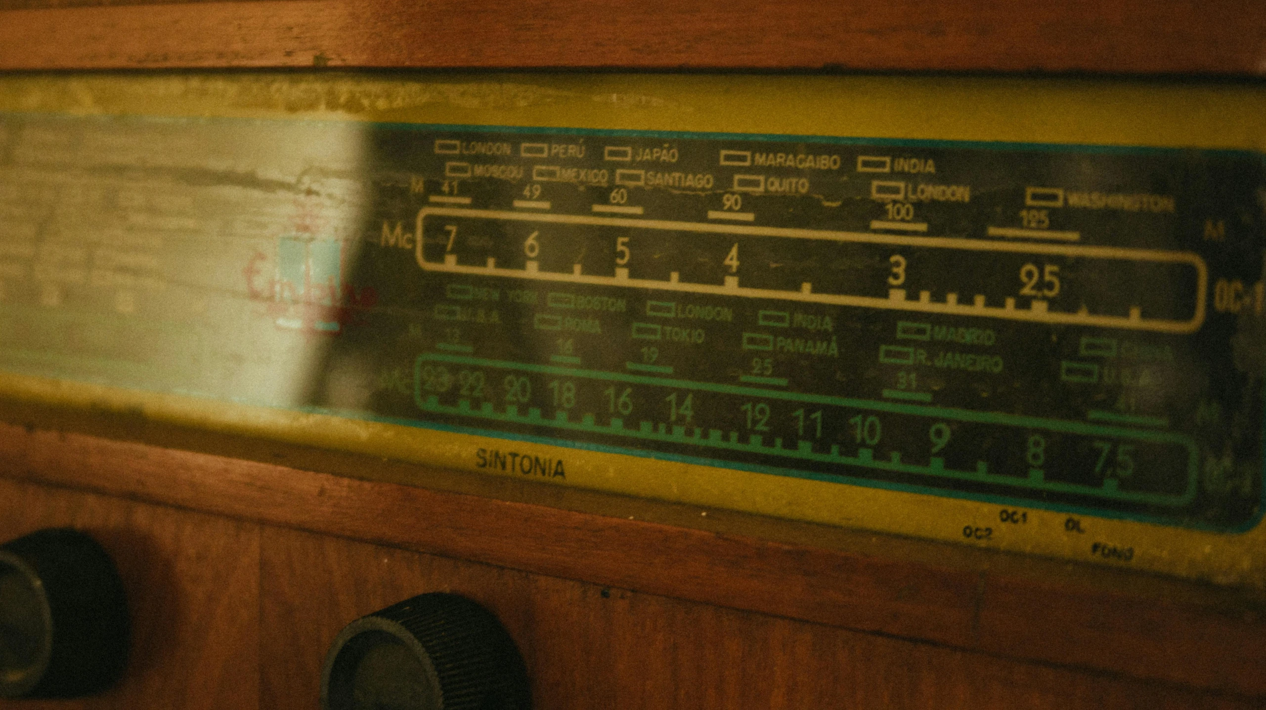 an old radio sitting on top of a wooden table, são paulo, charts, zoomed in, cottagecore hippie