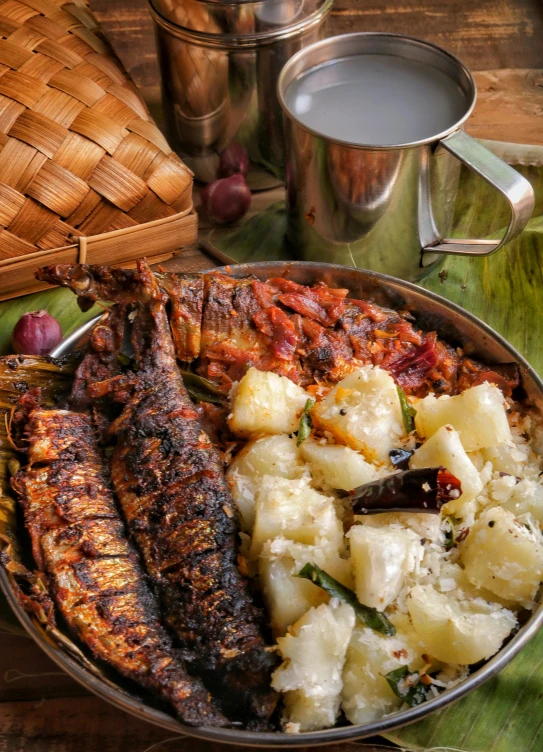 a close up of a plate of food on a table, by Ingrida Kadaka, hurufiyya, sardine in a can, sri lanka, thumbnail, rustic
