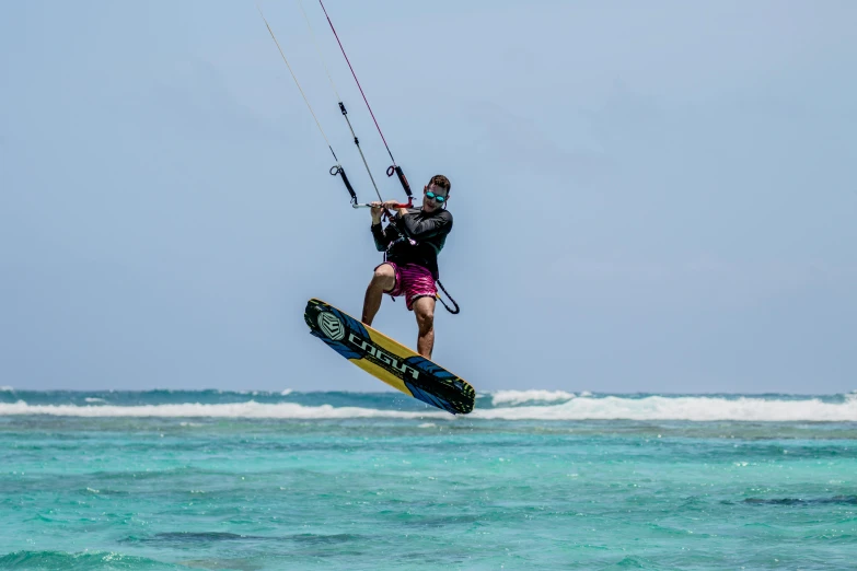a man flying through the air while riding a kiteboard, by Emanuel Witz, pexels contest winner, hurufiyya, avatar image, fishing, super high resolution, lagoon