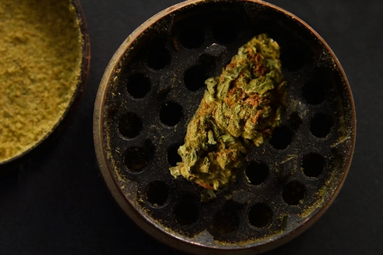 a pot of marijuana sitting on top of a frying pan, unsplash, hurufiyya, hunter biden smoking crack, fan favorite, medium closeup, flowering buds