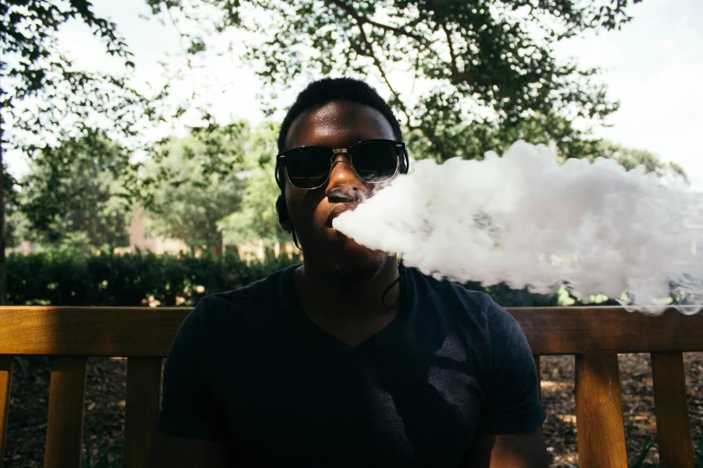a man sitting on a bench smoking a cigarette, pexels contest winner, a hookah smoking caterpillar, afro tech, sweaty. steam in air, black man