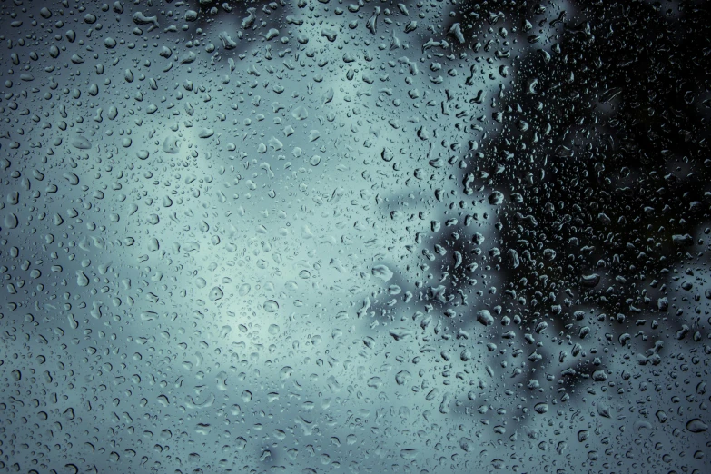 a window with rain drops on the glass