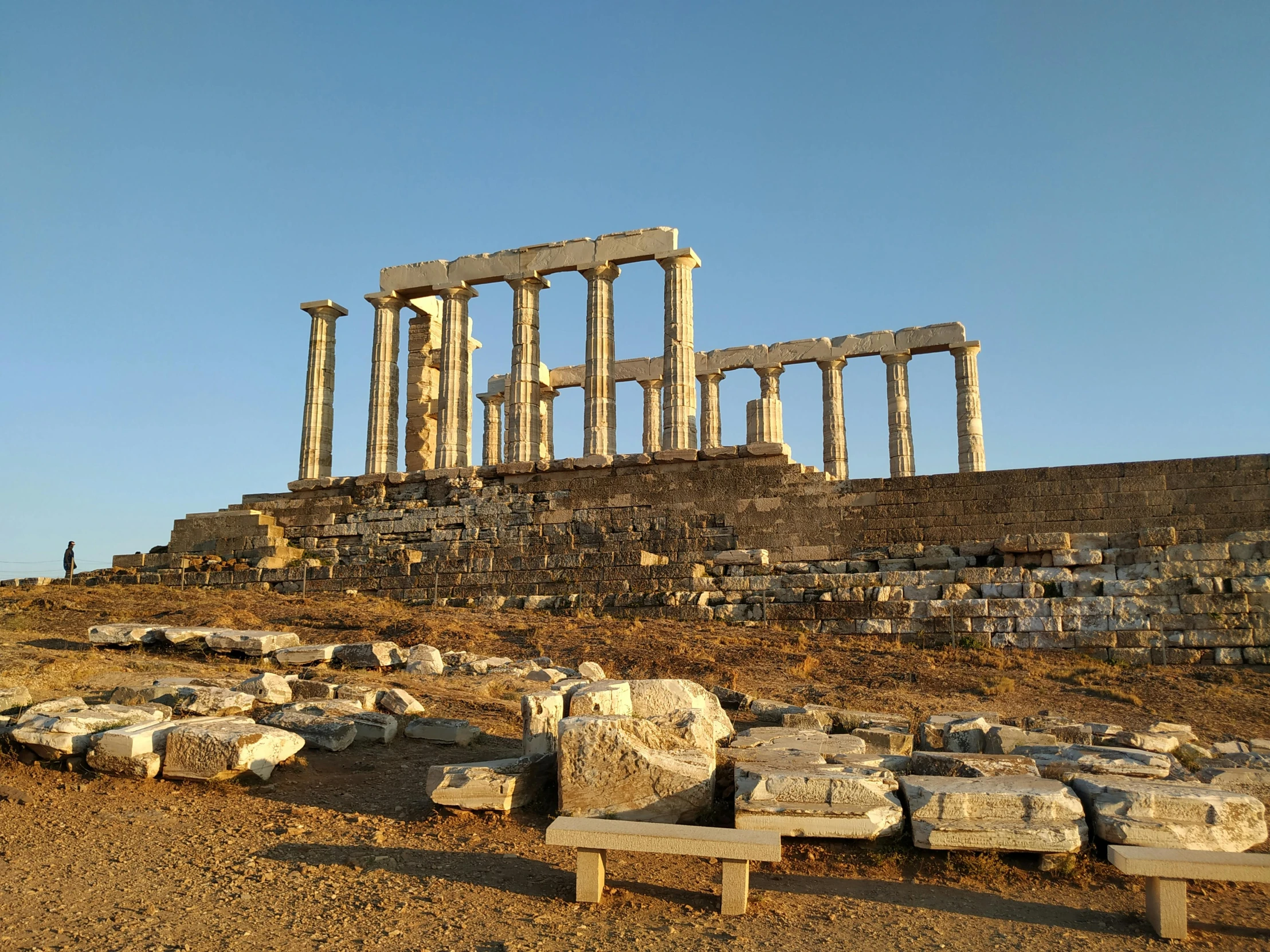 ancient ruins sit on the edge of a barren area