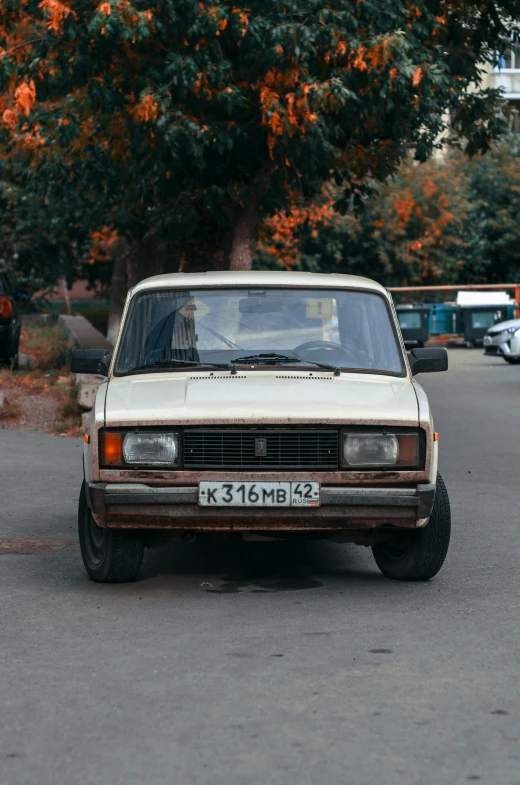 there is a small old pick up truck parked