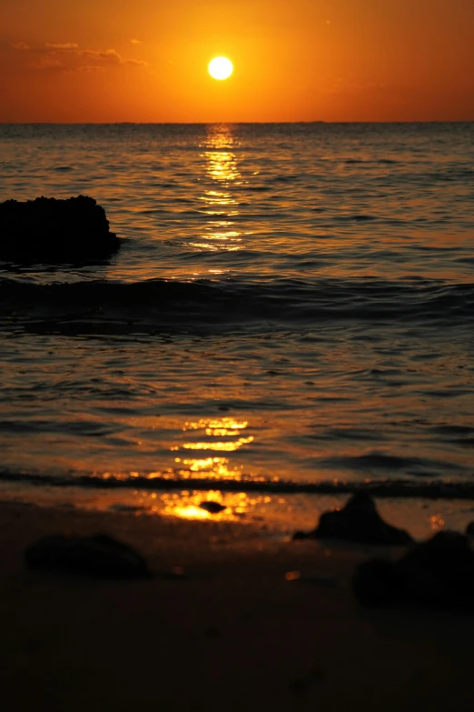 the sun is setting over the water at the beach, a picture, by Robbie Trevino, close, shimmering, mark