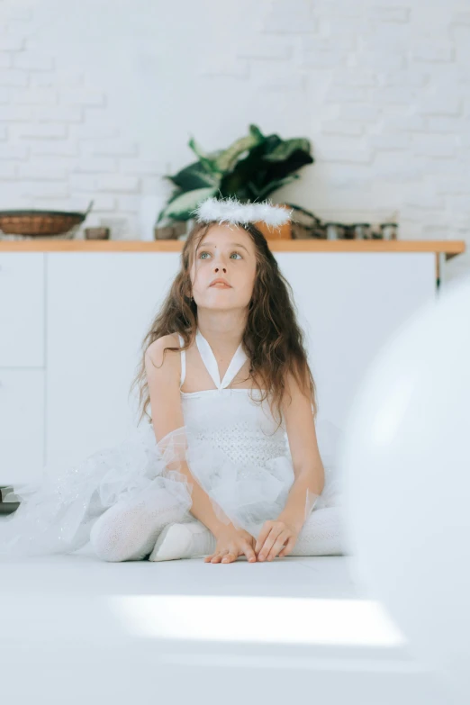 a little girl in a white dress sitting on the floor, pexels, wearing a fancy dress, in a kitchen, thinking pose, abcdefghijklmnopqrstuvwxyz