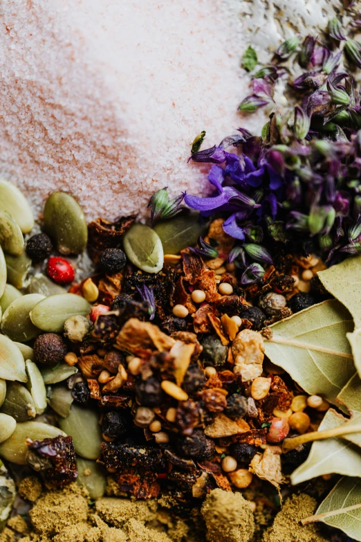 a bowl filled with different types of spices, a still life, by Julia Pishtar, trending on pexels, renaissance, made of dried flowers, upper body close up, split near the left, eating