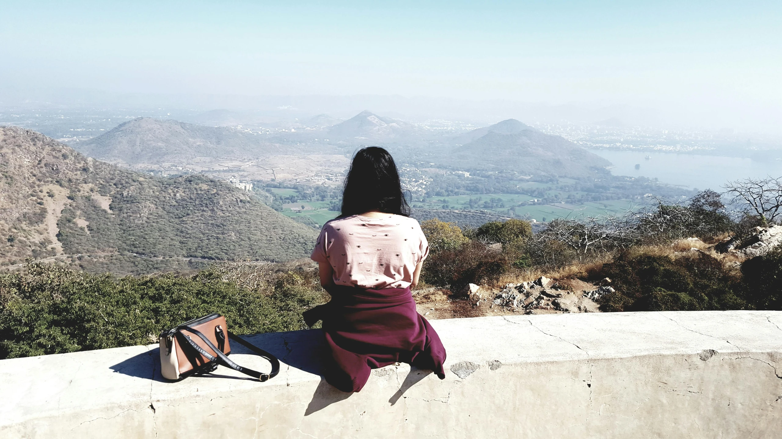 woman looking out over the mountainous hills and valleys