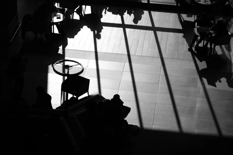 a black and white photo of people in an airport, a black and white photo, light and space, shadows. asian landscape, :: morning, in a library, sun down