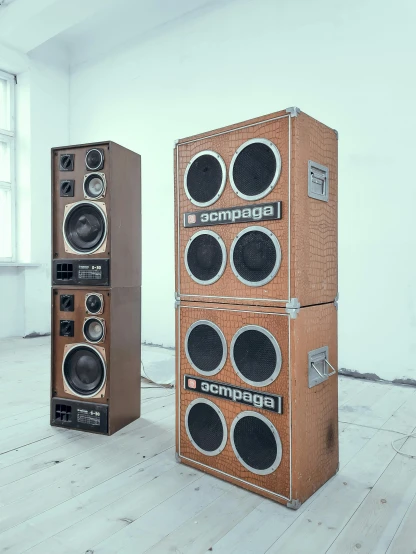 a couple of speakers sitting on top of a wooden floor, inspired by Carl Gustaf Pilo, assemblage, made of cardboard, hyperrealistic n- 4, brown, cabinets