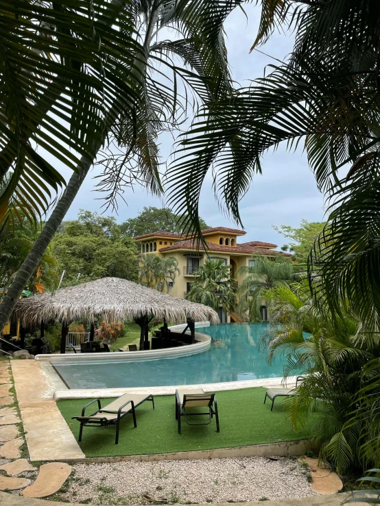 a view of some tables near the pool