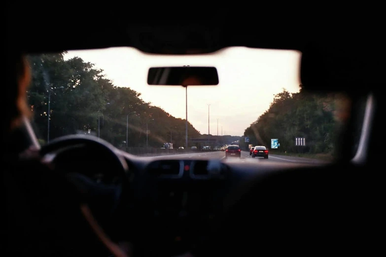 a car's windshield with the view outside of it