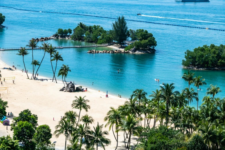 the beautiful blue waters surround an island and a beach