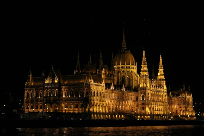 the hungarian parliament building lit up at night, pexels contest winner, cutout, square, brown, halloween