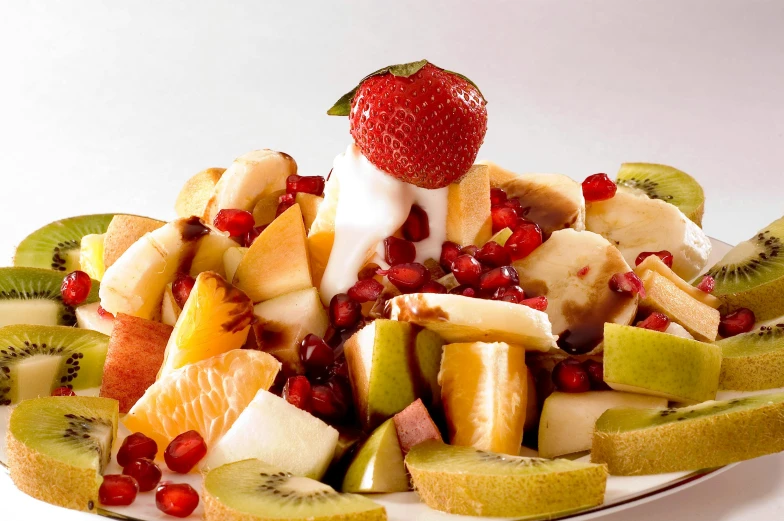 a white plate topped with sliced fruit and a strawberry, pomegranate, rafeal albuquerque, cheesy, background image