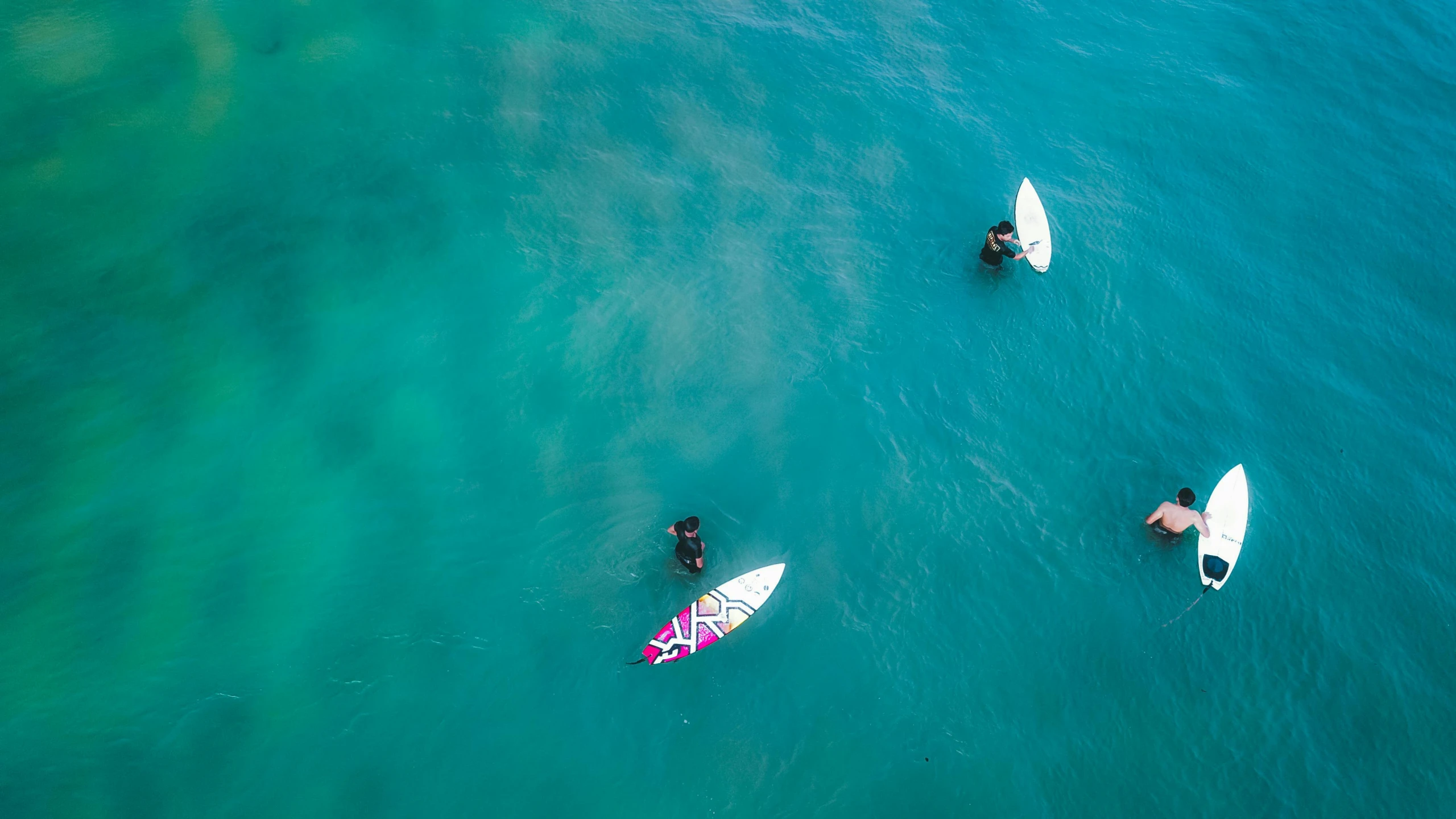 a group of people riding surfboards on top of a body of water, flatlay, 2 people, blue waters, greg rutwoski