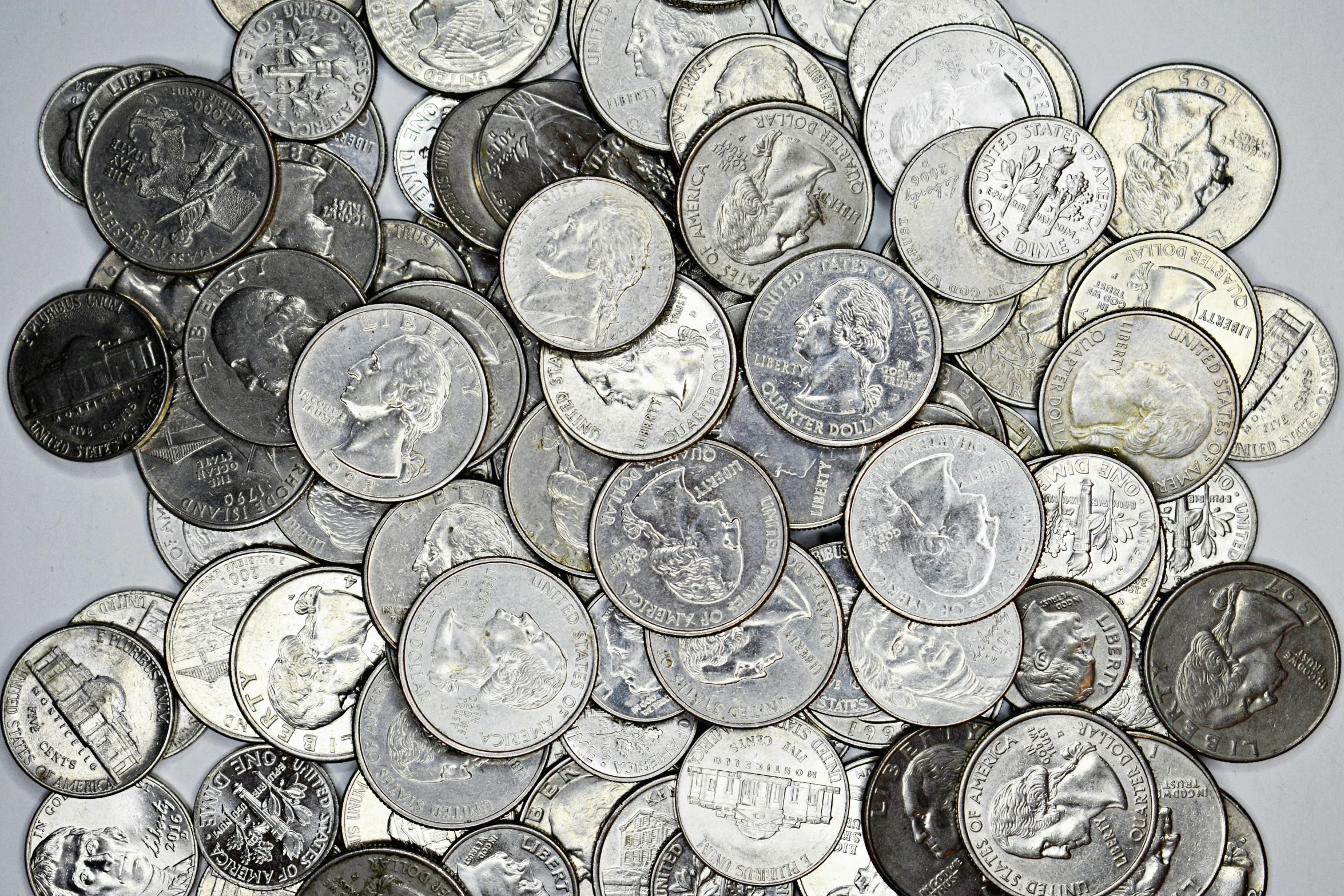 a pile of coins sitting on top of a table, palladium, highly detailed ”, chicago, full res