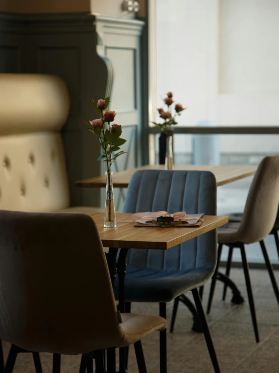 a table with chairs next to two tables