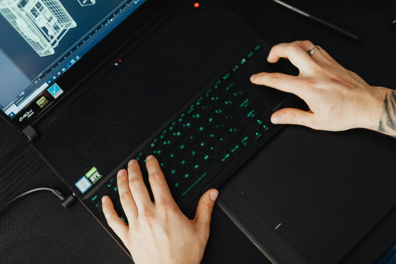 a close up of a person typing on a laptop, /r/razer, avatar image, high angle shot, thumbnail