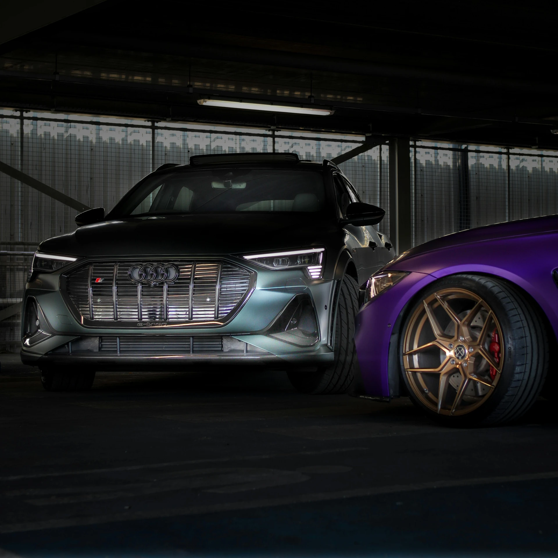 two cars parked next to each other in a garage, a 3D render, by Drew Tucker, pexels contest winner, rim lights purple and green, 2 0 2 1 formula 1 audi car, epic stance, ultra high quality model