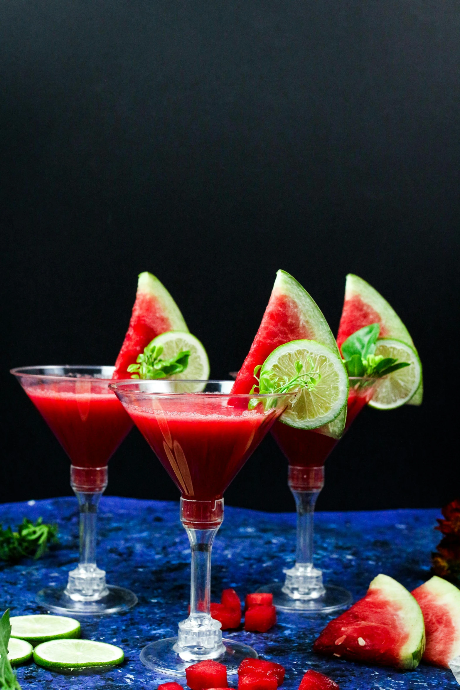 a table topped with three glasses filled with fruit and veggies, profile image, watermelon, red liquid, food