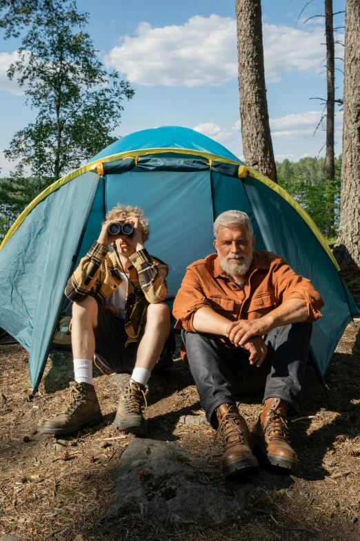 a man and a woman sitting in front of a tent, binoculars, mr beast, an oldman, dylan kowalski