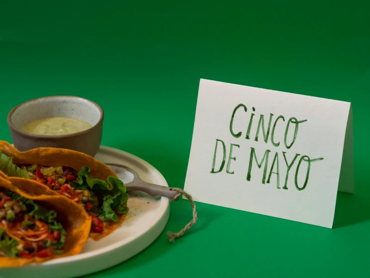 a plate of tacos and a sign that says cinco de mayoo, pexels contest winner, dezeen, product display photograph, green, mayo