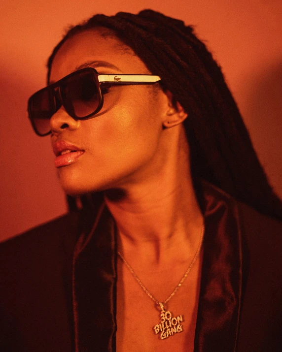 a close up of a person wearing sunglasses, an album cover, inspired by Wang E, trending on pexels, afrofuturism, naomi campbell, warm moody lighting, prideful look, t pose