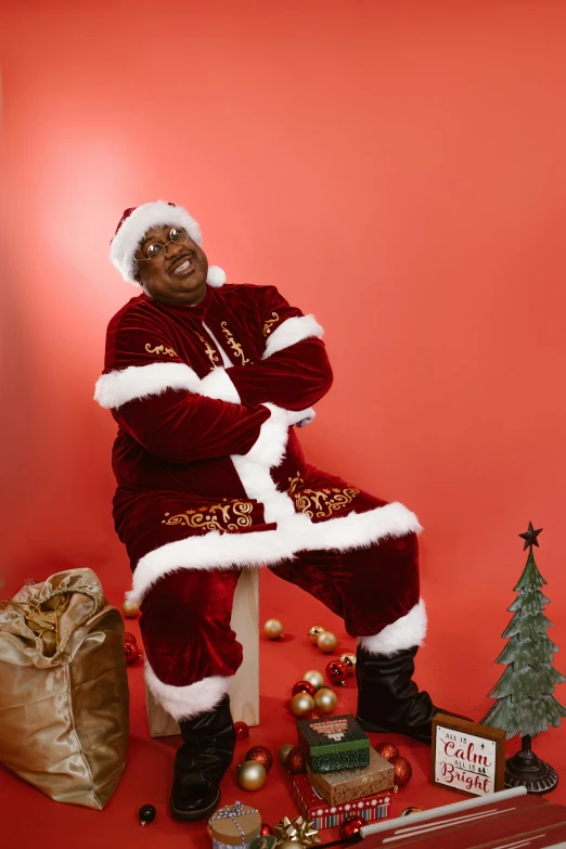 an african american man dressed in christmas outfits