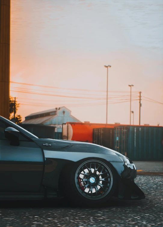 a car is parked next to an industrial building