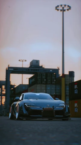 the car is parked at sunset with a very large city behind it