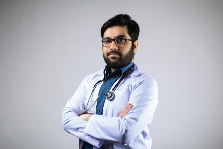 a male doctor is wearing a blue tie