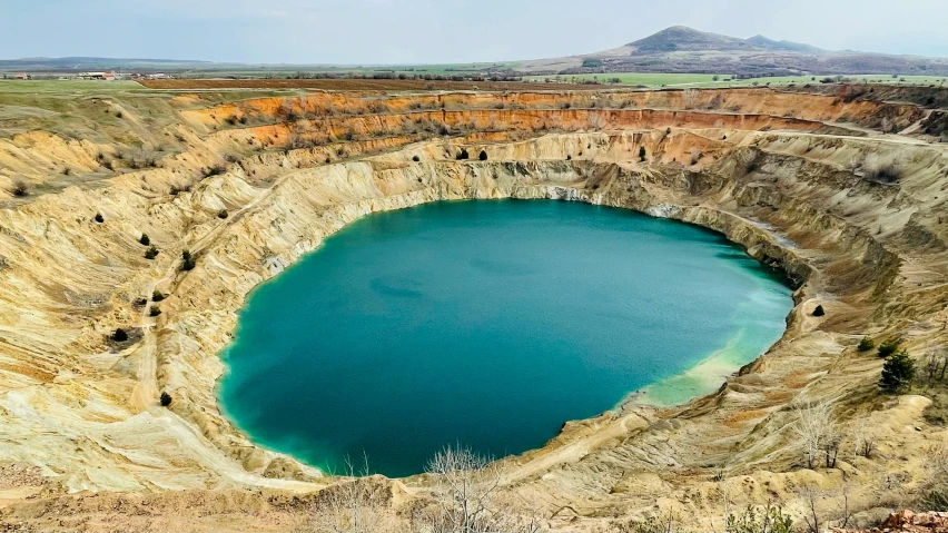 a large lake surrounded by barren mountains