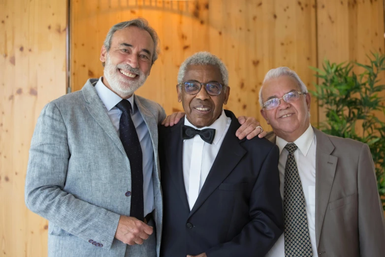 a group of three men standing next to each other, by Werner Andermatt, pexels contest winner, wearing a suit and glasses, senor salme, gentlemens dinner, diverse