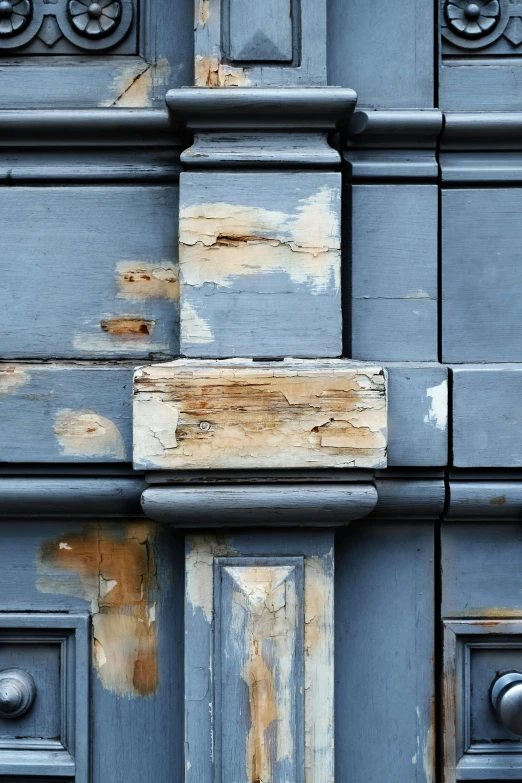 a close up of a door on a building, a picture, inspired by Richter, unsplash, renaissance, damaged buildings, square, blue gray, made of wood