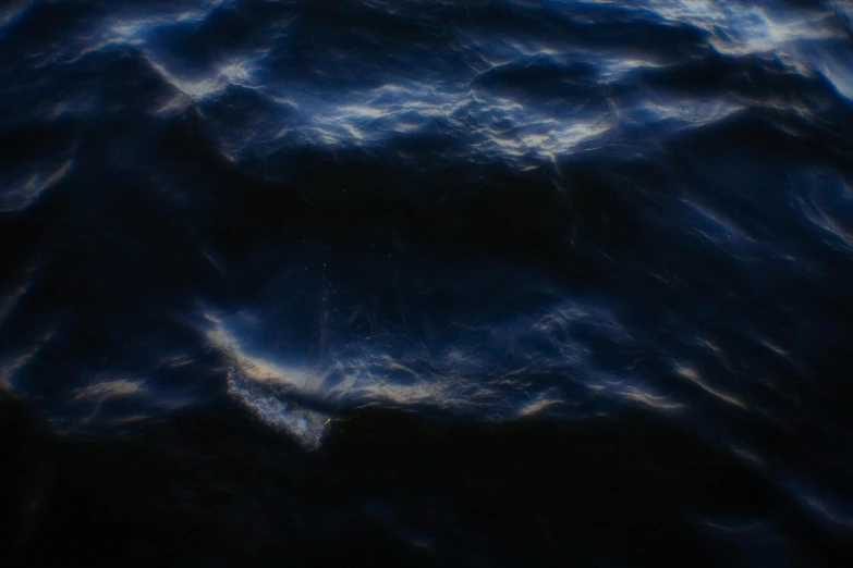 an abstract painting of a wavy ocean water surface