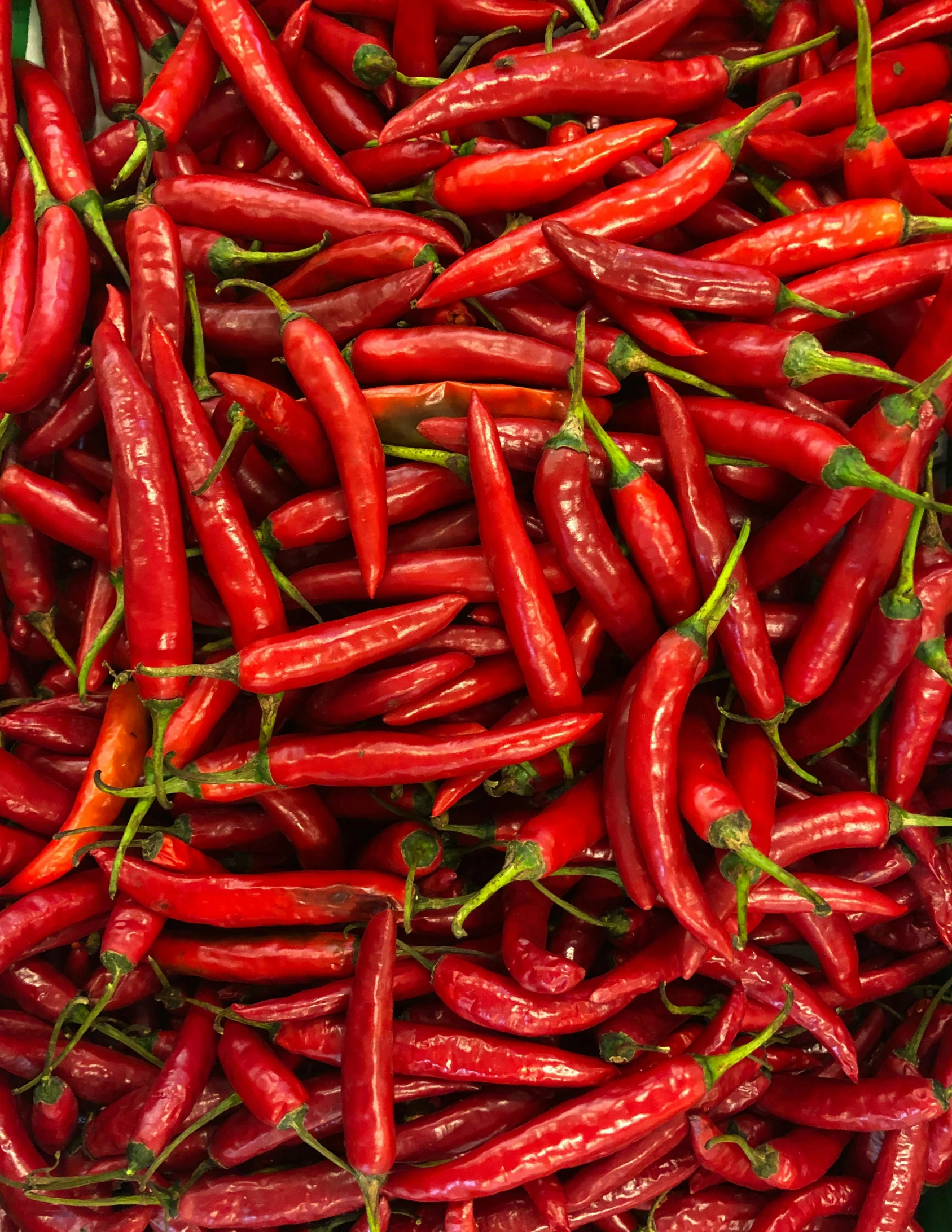 a pile of red hot peppers sitting on top of a table, trending on pexels, process art, background image, thumbnail, indonesia, multiple stories