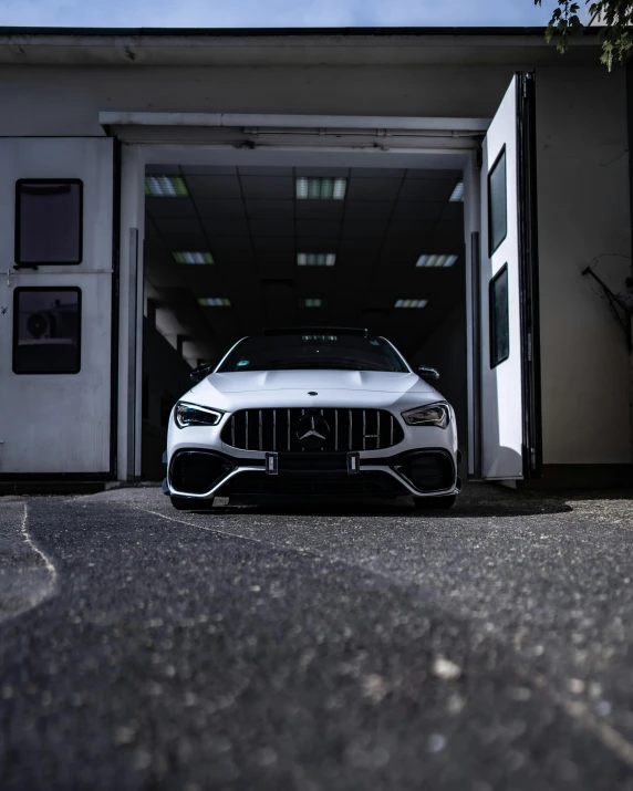 the mercedes benz car is parked in the garage